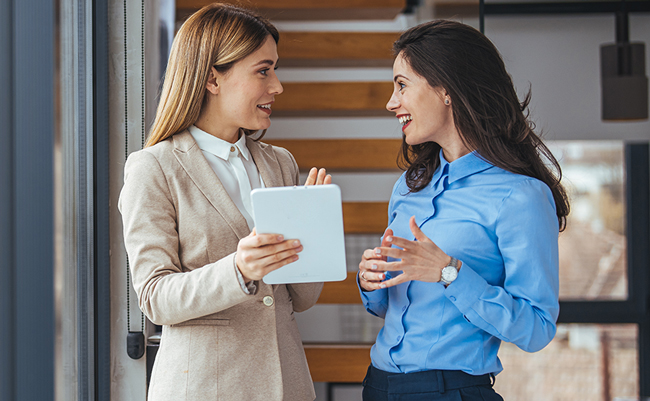 Real estate agents talking to each other